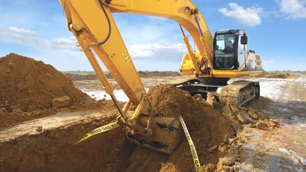 a construction vehicle digging a hole in the ground