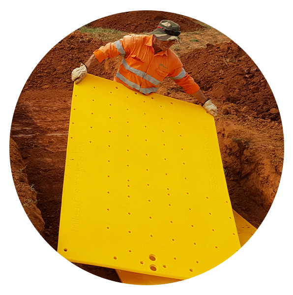 man holding overpipe plate