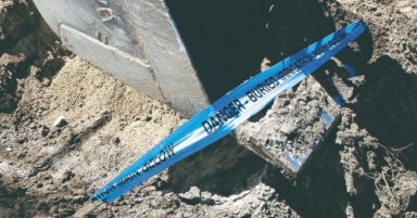 a blue underground warning tape